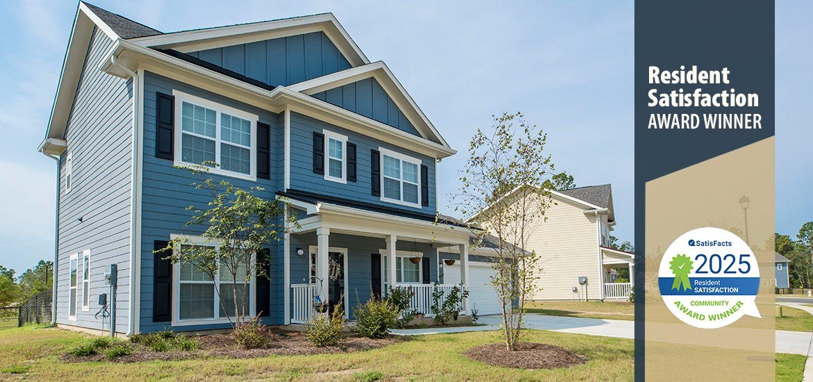 A blue house with a sign that says Resident Satisfaction Award Winner.